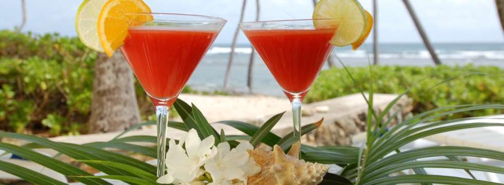 Tropical cocktail in hand, toes in the sand.