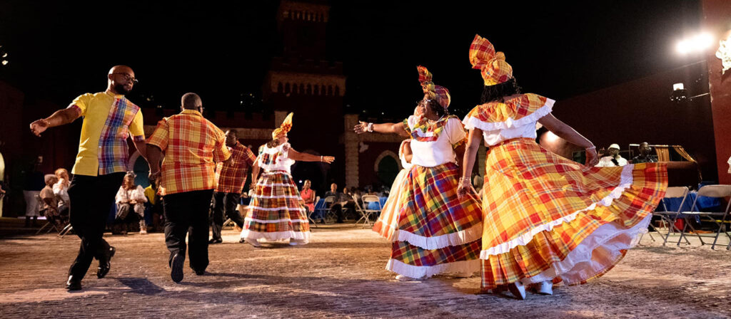 St. Croix quadrille dancers performing at night