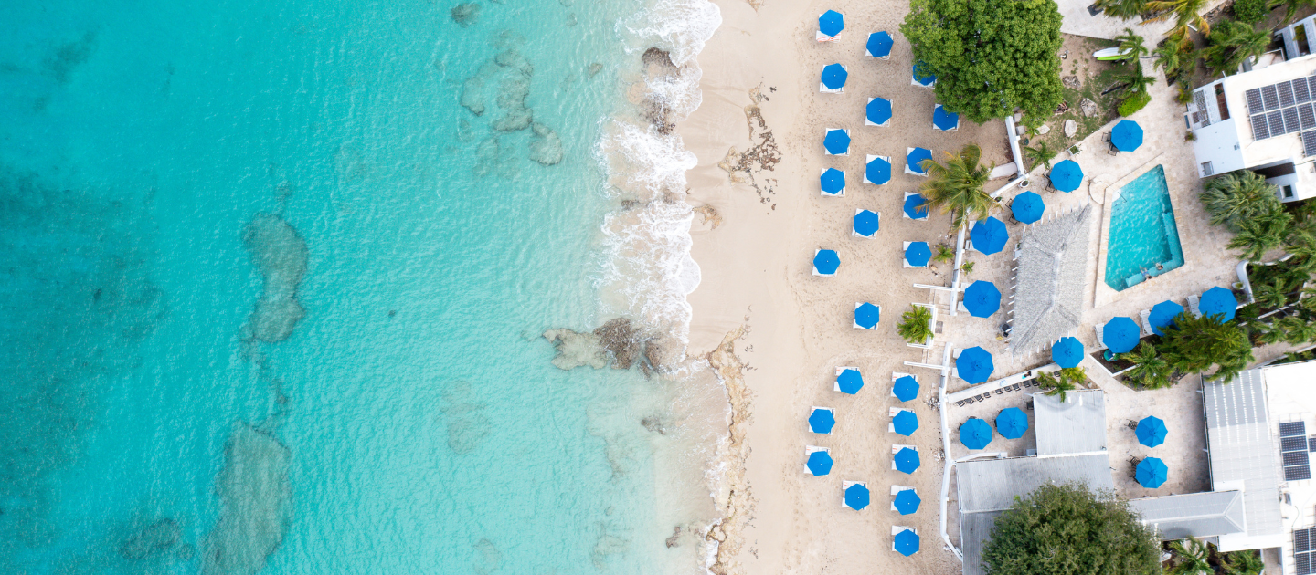 feat sand castle on the beach aerial water