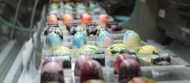 gallery display case of bon bons fb 4 768x337