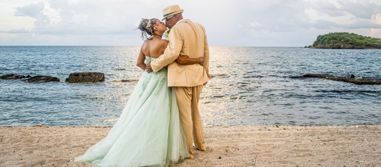 gallery tamarind reef resort couple kissing on beach 768x336