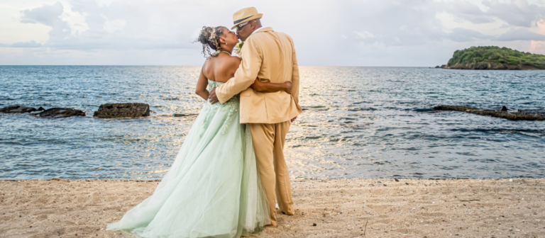 gallery tamarind reef resort couple kissing on beach 768x336